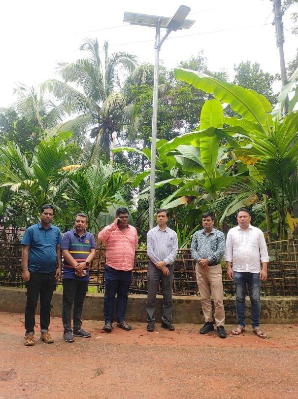 Officials at a newly installed solar street light in Baghaichari