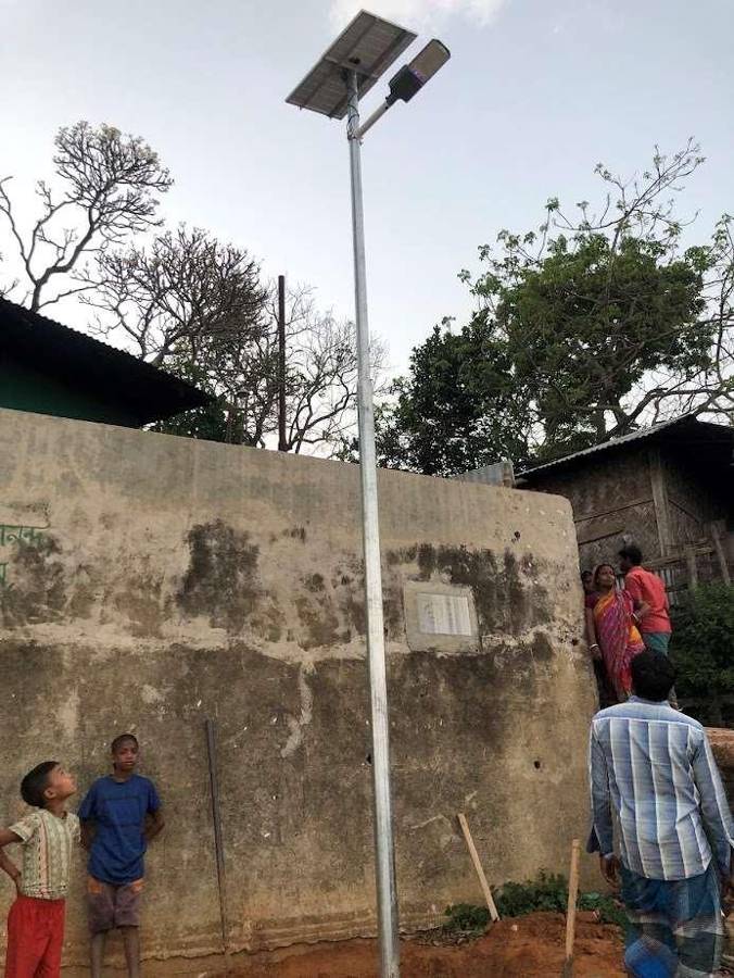 Solar street light on a hillside lane in Rangamati, daytime